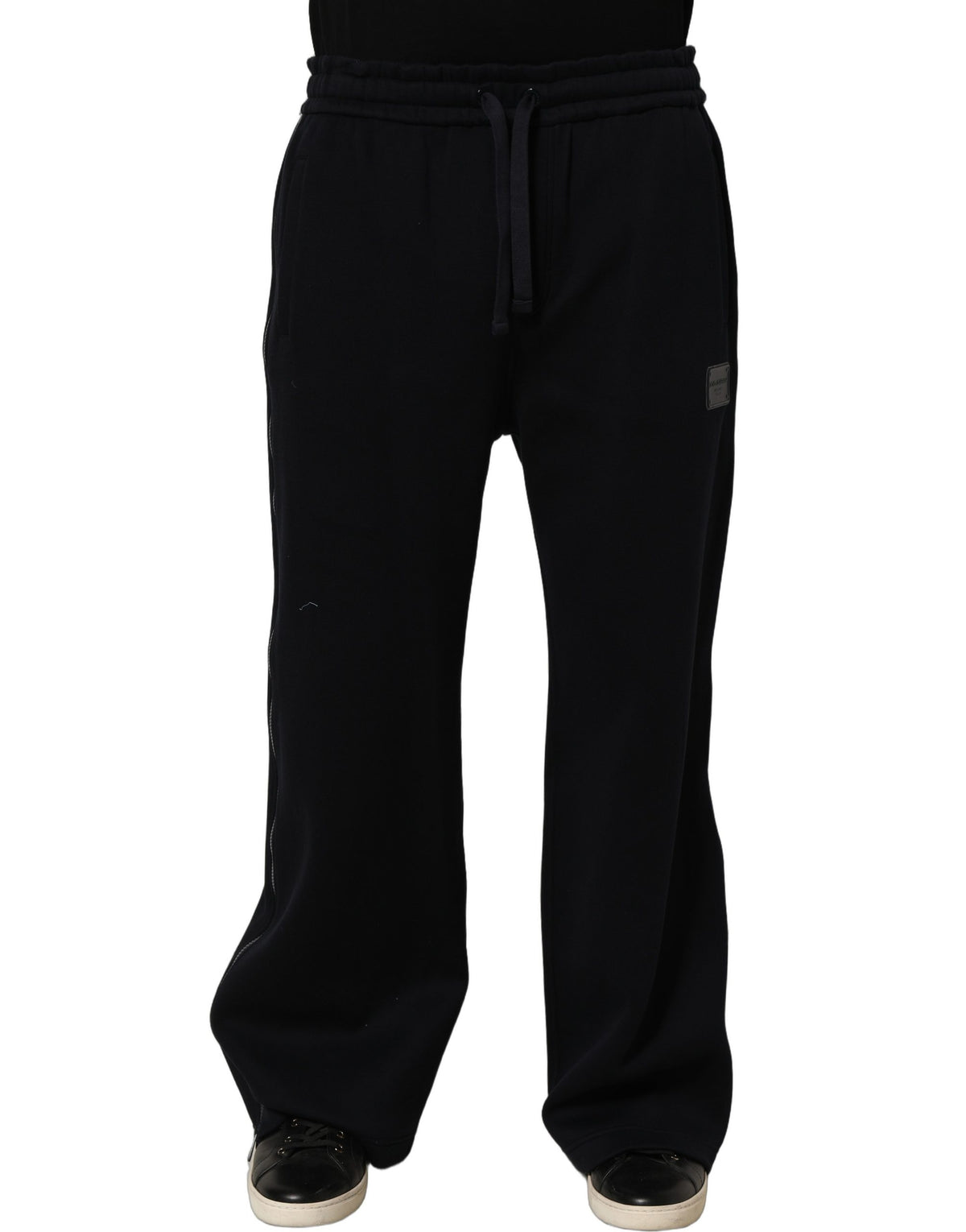Joggers by Dolce & Gabbana for men in viscose dark-blue presents a refined pantology silhouette, artfully defined by a refined pantology relaxed-fit & wide, long, and a sophisticated .