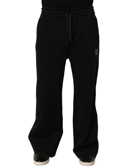 Joggers by Dolce & Gabbana for men in viscose dark-blue presents a refined pantology silhouette, artfully defined by a refined pantology relaxed-fit & wide, long, and a sophisticated .