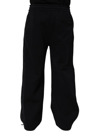 Joggers by Dolce & Gabbana for men in viscose dark-blue features a polished silhouette with a polished relaxed-fit & wide, reaching a polished long and finished with a polished .