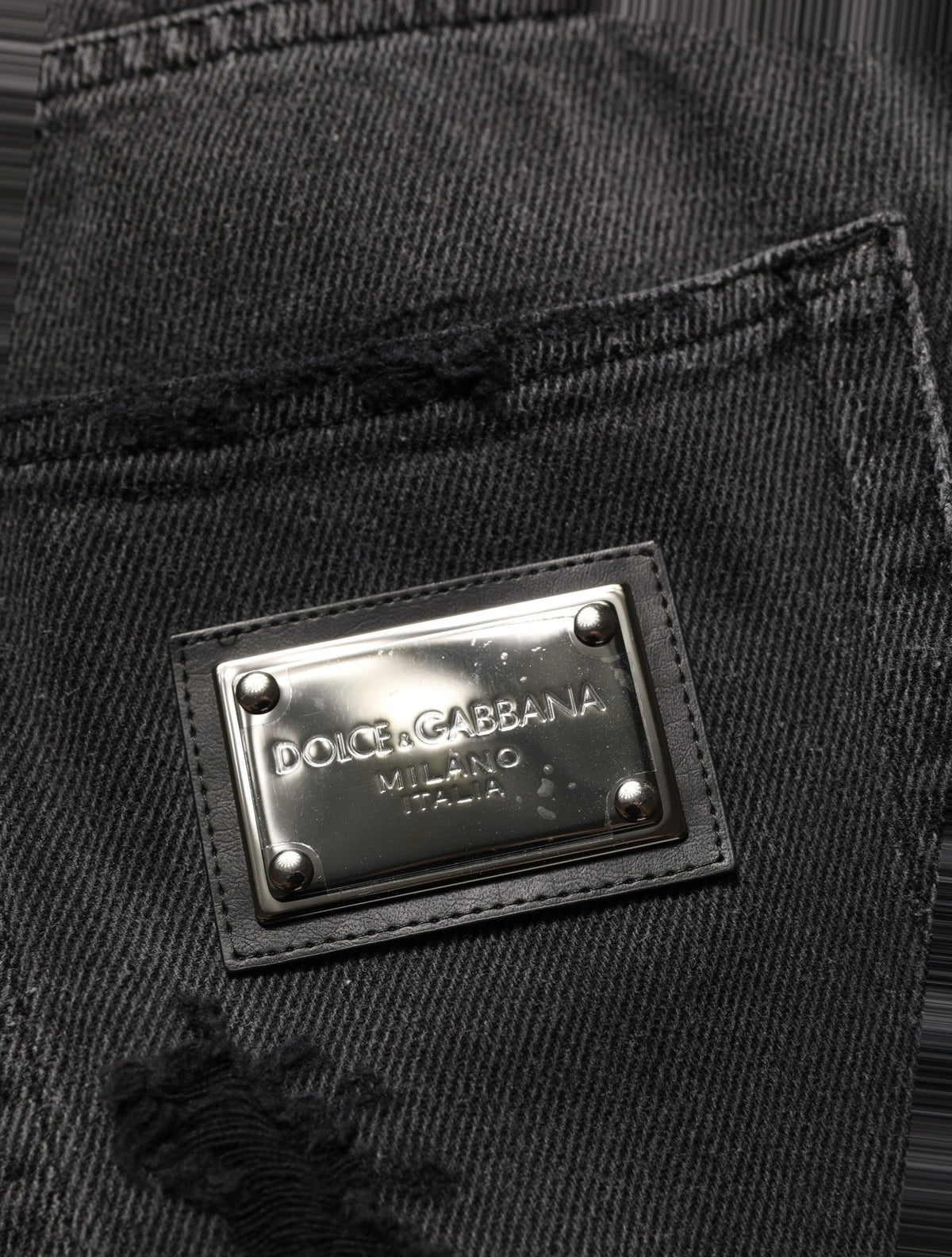 Jeans by Dolce & Gabbana for men in distressed cotton denim dark-gray & signature features an sophisticated and flared, relaxed-fit, wide & oversized with a precise long, creating a sophisticated and sophisticated silhouette.