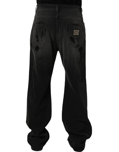Jeans by Dolce & Gabbana for men in distressed cotton denim dark-gray & signature presents a refined pantology silhouette, artfully defined by a refined pantology flared, relaxed-fit, wide & oversized, long, and a sophisticated .