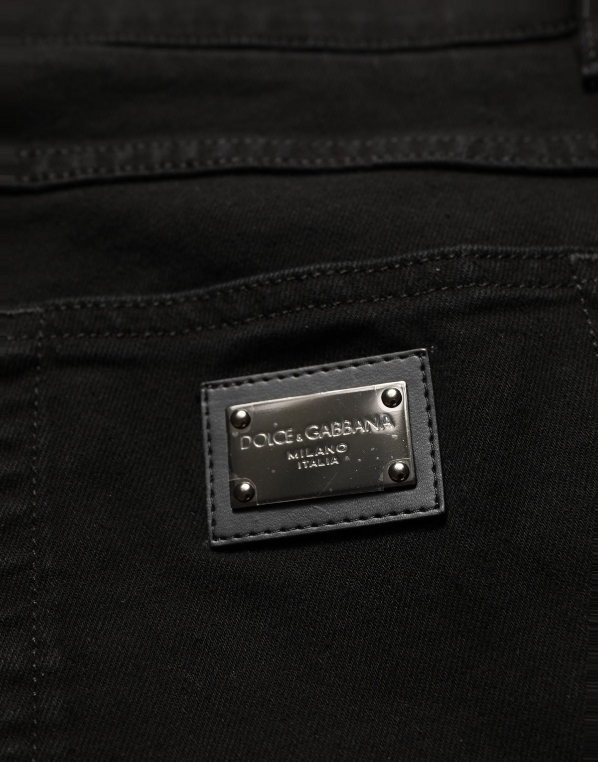 Jeans by Dolce & Gabbana for men in stretch denim cotton black & signature presents a refined pantology silhouette, artfully defined by a refined pantology skinny & regular-fit, long, and a sophisticated mid rise.