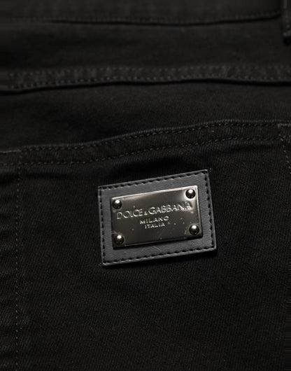 Jeans by Dolce & Gabbana for men in stretch denim cotton black & signature presents a refined pantology silhouette, artfully defined by a refined pantology skinny & regular-fit, long, and a sophisticated mid rise.