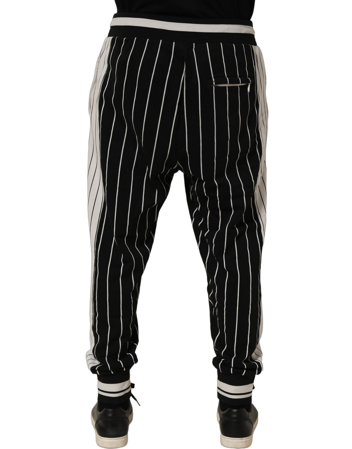 Jogger Sweatpants by Dolce & Gabbana for men in cotton black, white, pinstripe & striped features a contemporary silhouette with , a contemporary , long hem, and for a premium, high-performance aesthetic.