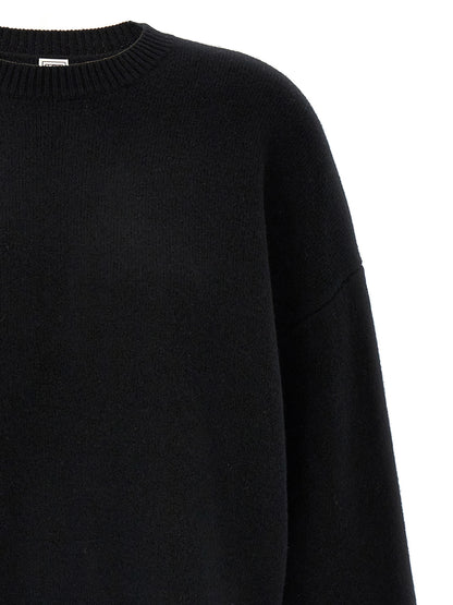 Cardigan by TOTEME for women in wool & polyester black showcases a captivating silhouette, artfully detailed with a captivating and crew neckline for a truly sophisticated captivating look.