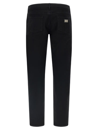 Jeans by Dolce & Gabbana for men in stretch denim cotton black features an refined tailoring silhouette, showcasing a premium slim with a and long cut for a refined tailoring look.