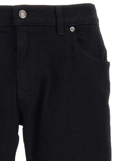 Jeans by Dolce & Gabbana for men in stretch denim cotton black presents a tailored silhouette, showcasing a tailored slim and long cut with a refined for a truly tailored aesthetic.