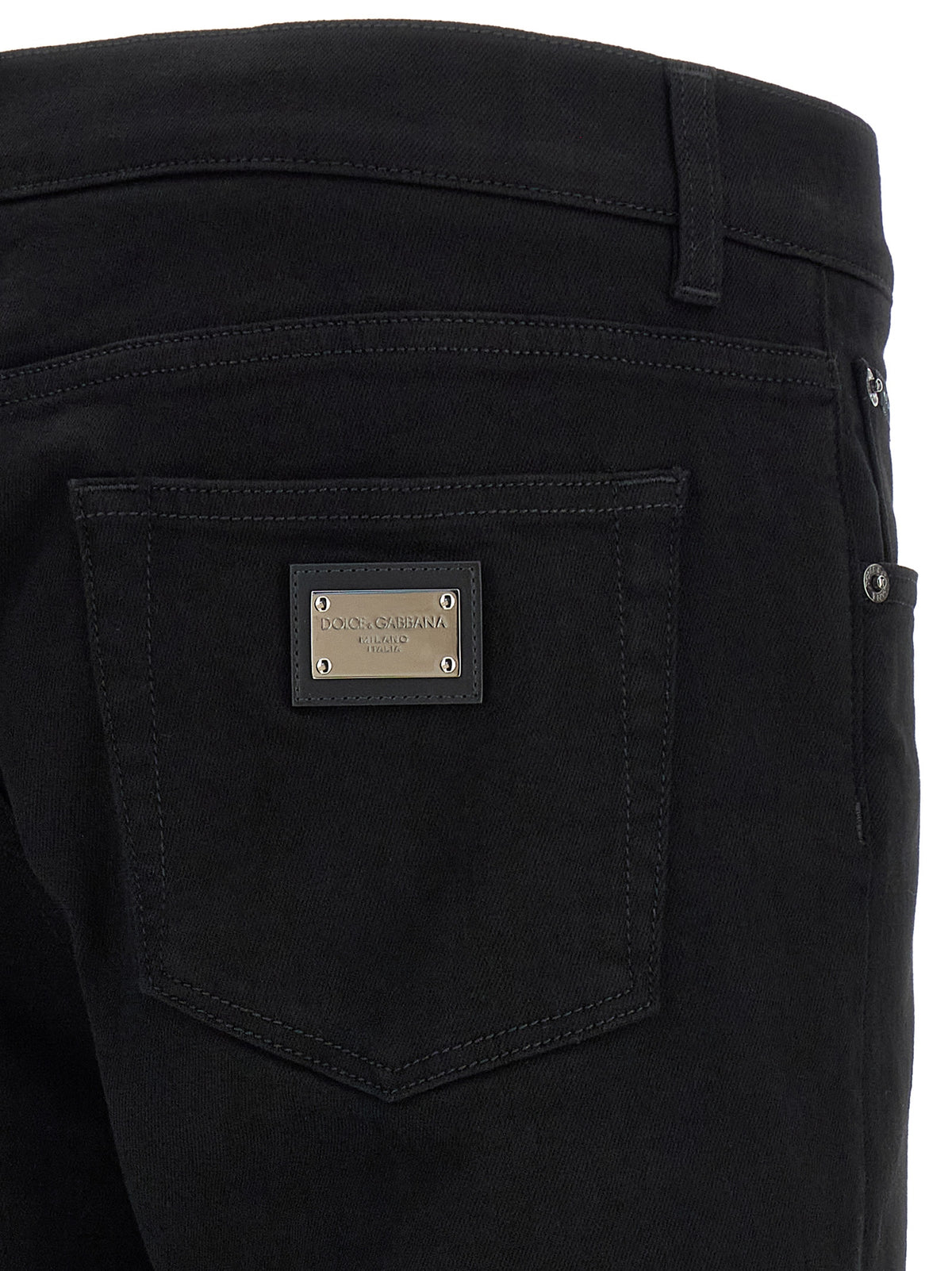 Jeans by Dolce & Gabbana for men in stretch denim cotton black features a polished silhouette with a polished slim, reaching a polished long and finished with a polished .