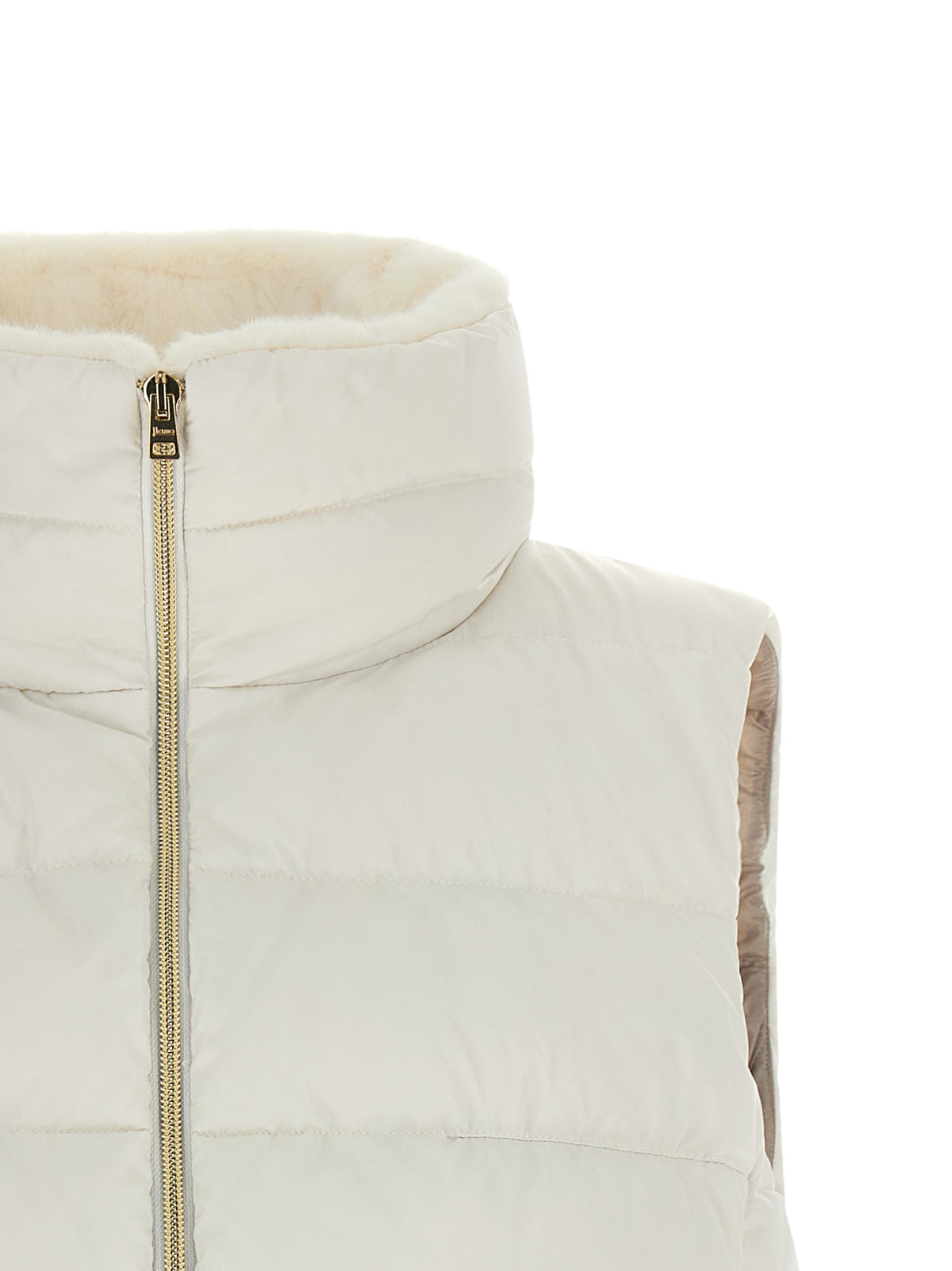 Vest by Herno for women in polyester satin gold, white & signature features a enviable silhouette, elegantly detailed with a enviable and functional pockets & insulated for a enviable finish.