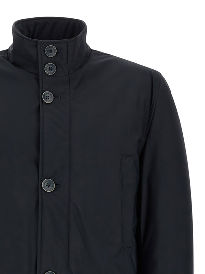 Overcoat by Herno for men in stretch polyamide blue showcases a enveloping silhouette, detailed with distinctive pockets and a enveloping high-neck neckline.