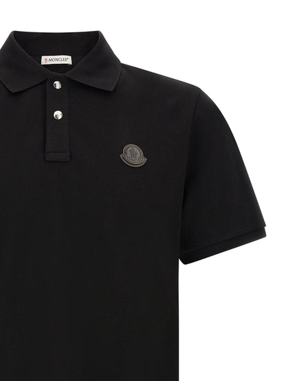 Polo Shirt by Moncler for men in leather & cotton black presents a sleek silhouette, featuring a refined and for a sleek finish.