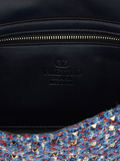 2-in-1 Shoulder & Crossbody Handbag by Valentino Garavani for women in cotton tweed leather & virgin wool blue features an versatile silhouette, showcasing a secure zipper and versatile with versatile crossbody-strap & shoulder-strap for a versatile finish.