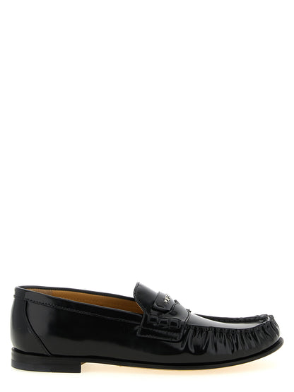Flat Moccasin Moccasins Loafer Slip-On Shoes by Fendi for women in calfskin leather & palladium black & palladium features an effortless chic silhouette, showcasing the Women's Calfskin Leather & Palladium Flat Moccasin Moccasins Loafer Slip-On Shoes design with an effortless chic flat and a for a effortless chic look.