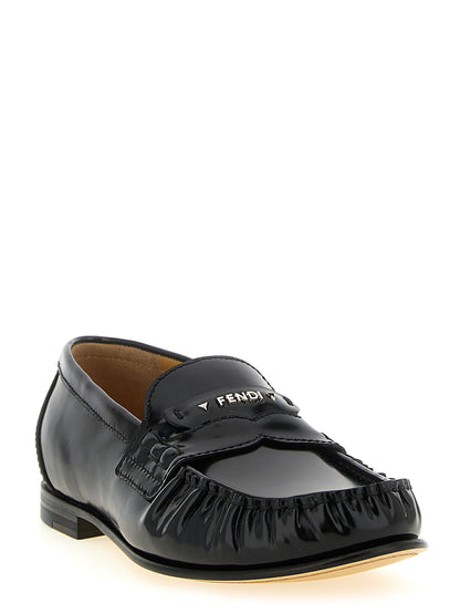 Flat Moccasin Moccasins Loafer Slip-On Shoes by Fendi for women in calfskin leather & palladium black & palladium showcases a timeless silhouette from the Women's Calfskin Leather & Palladium Flat Moccasin Moccasins Loafer Slip-On Shoes collection, featuring a timeless flat and for a timeless finish.