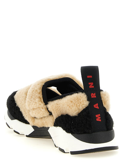 Sneakers by Marni for women in lamb leather bicolour, beige, black, white & signature presents a on trend silhouette from the Women's Slip On Chunky Lamb Leather Sneakers collection, showcasing a on trend slip-on chunky style for an elevated aesthetic.