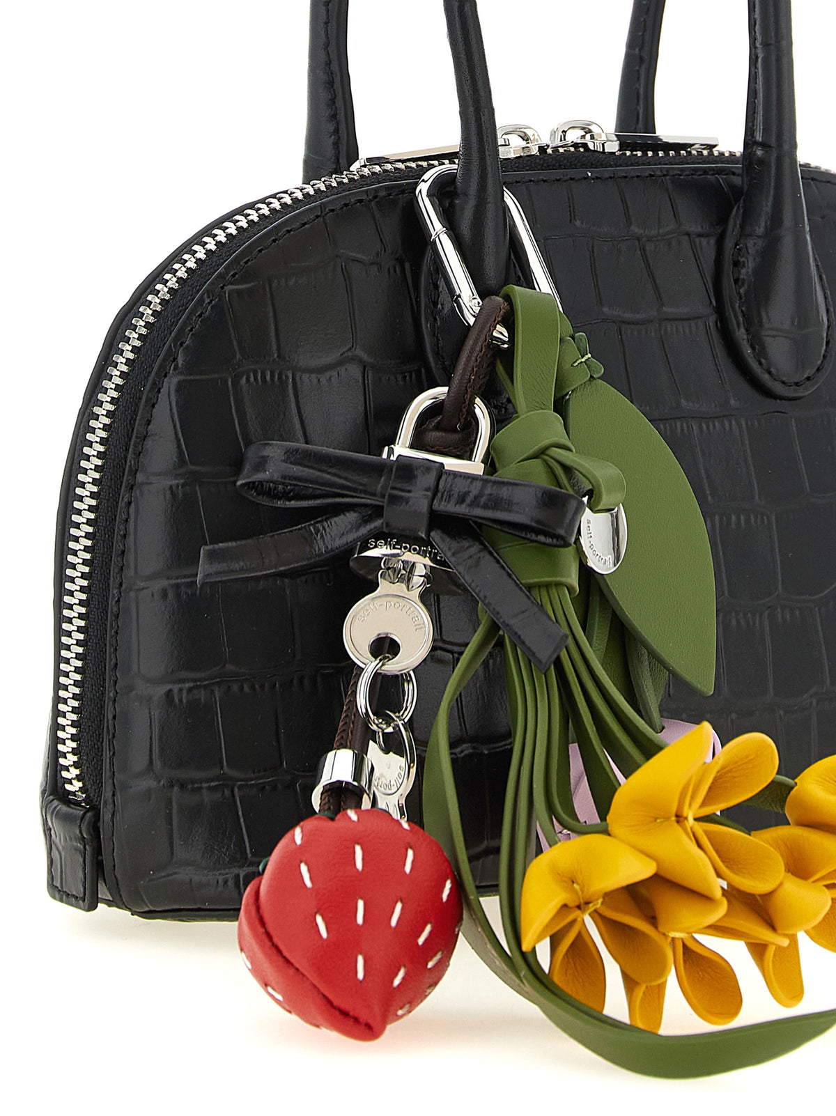 Dome Handbag by Self-Portrait for women in bos taurus cowhide leather black & print features an refined silhouette, showcasing a secure zipper, ample , and versatile shoulder-strap, detachable-strap & handle for a sophisticated refined aesthetic.