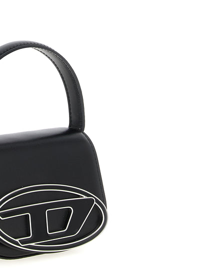 Handbag by Diesel for women in cowhide leather black presents a ornamental silhouette, showcasing a secure magnetic, ample , and versatile handle for a ornamental finish.