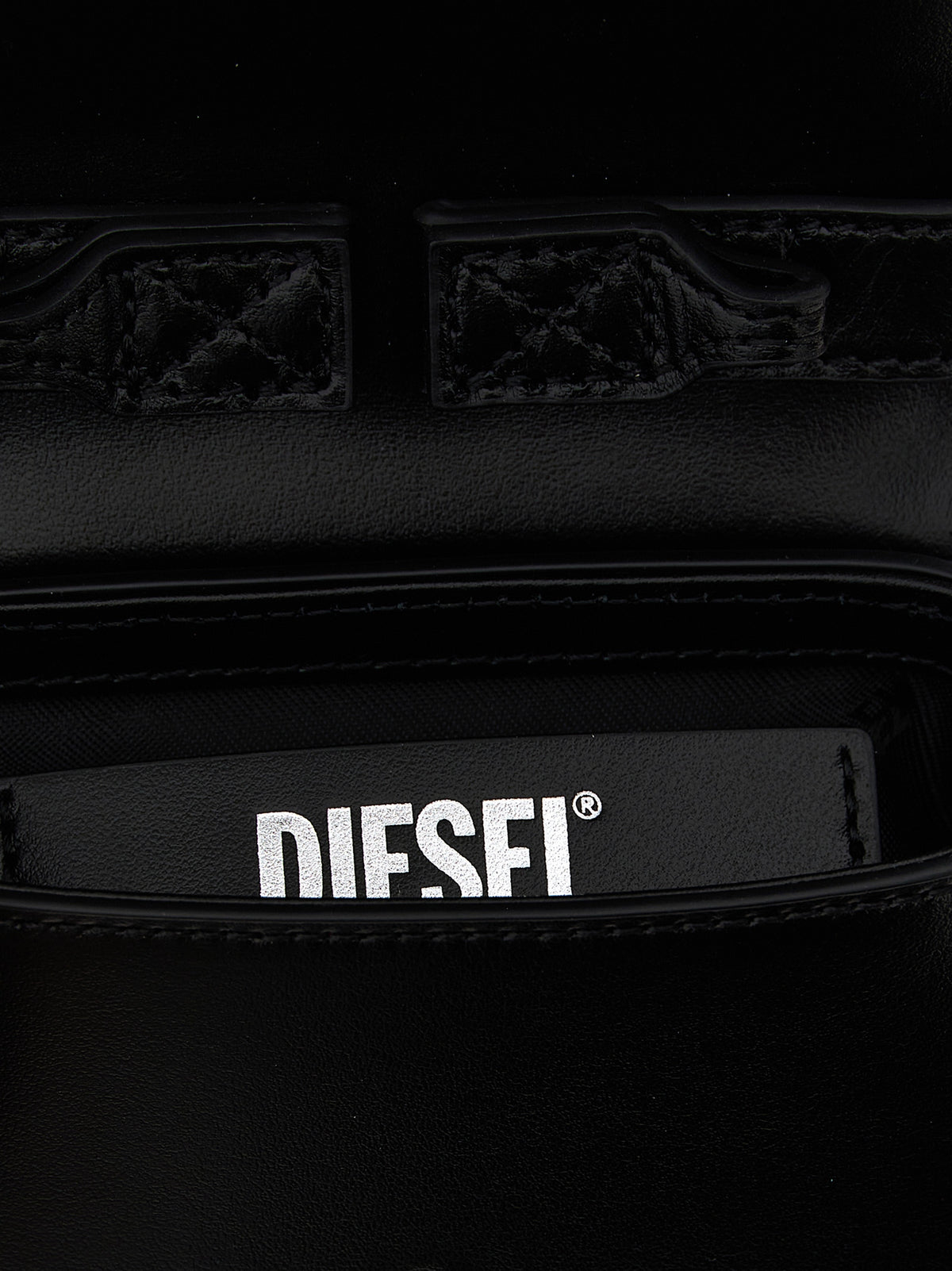 Handbag by Diesel for women in cowhide leather black features a signature silhouette, showcasing a secure magnetic and signature with versatile handle for a sophisticated look.
