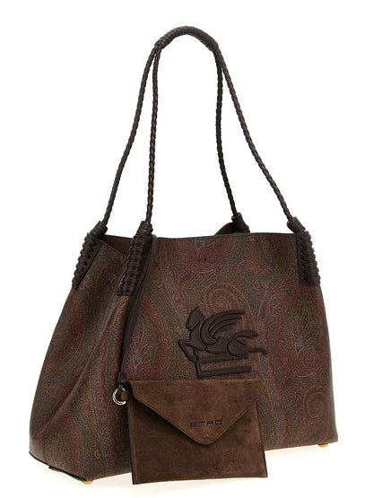 This Shopper Tote Clutch Bag by Etro for women in polyester suede leather & cotton brown & paisley features an on trend Polyester Suede Leather & Cotton Shopper Tote Clutch Bag design with a secure snap & hook, ample , and on trend handle.