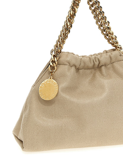 Crossbody Handbag by Stella McCartney for women in polyester beige & signature features a multifaceted silhouette, showcasing a secure magnetic and multifaceted with versatile crossbody-strap & shoulder-strap for multifaceted style.
