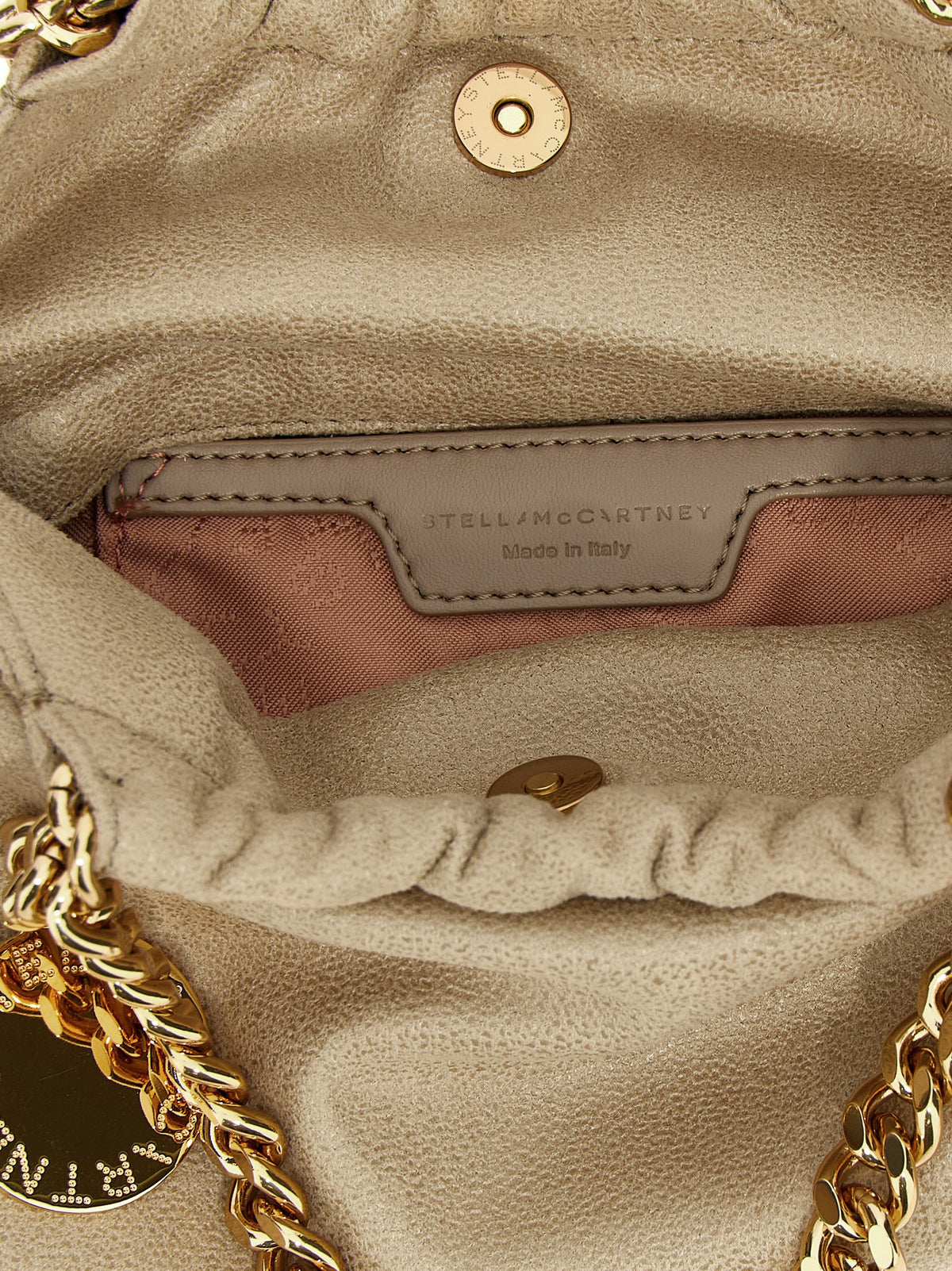 Crossbody Handbag by Stella McCartney for women in polyester beige & signature features a transformative elegance silhouette, showcasing a secure magnetic, organized , and versatile crossbody-strap & shoulder-strap for a transformative elegance look.