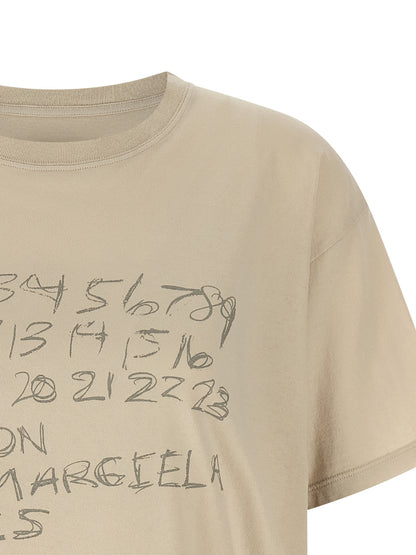 T-Shirt by Maison Margiela for women in cotton beige, signature & print features an edgy silhouette, meticulously detailed with a sophisticated and for a truly edgy finish.