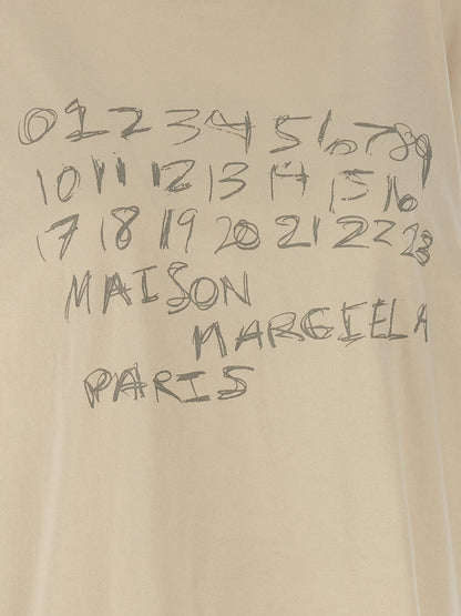 T-Shirt by Maison Margiela for women in cotton beige, signature & print showcases a unassuming silhouette, artfully detailed with a refined and unassuming for a sophisticated, contemporary look.