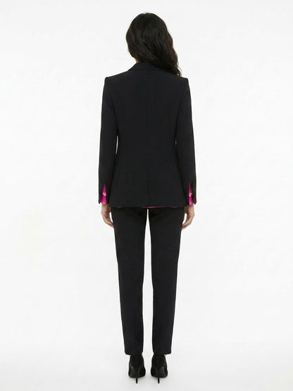 Pant Suit by Dolce & Gabbana for women in silk black presents a sharp silhouette, artfully finished with a sharp and a sophisticated for a truly sharp look.