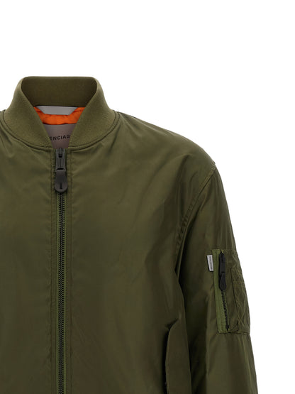 This Bomber Jacket by Balenciaga for men in polyamide bicolour, green & olive exhibits a edgy silhouette, meticulously detailed with functional pockets and a edgy for a edgy finish.