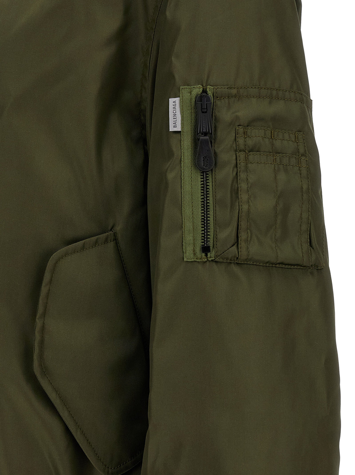 Bomber Jacket by Balenciaga for men in polyamide bicolour, green & olive showcases a bohemian silhouette, artfully detailed with a bohemian and signature pockets for a truly bohemian finish.