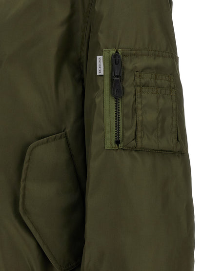Bomber Jacket by Balenciaga for men in polyamide bicolour, green & olive showcases a bohemian silhouette, artfully detailed with a bohemian and signature pockets for a truly bohemian finish.