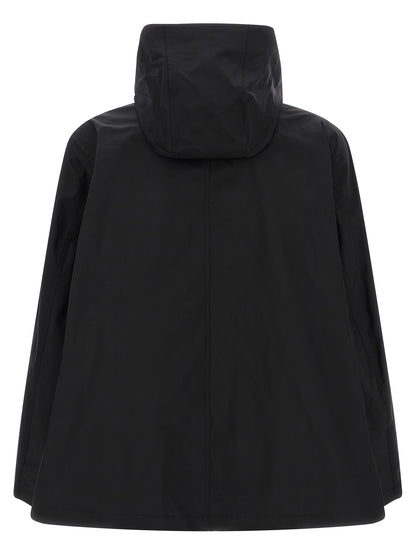 This Hooded Parka by Balenciaga for men in polyester twill black presents a utilitarian silhouette, meticulously detailed with hooded & windproof and a utilitarian hooded high-neck neckline for a sophisticated, weather-ready look.