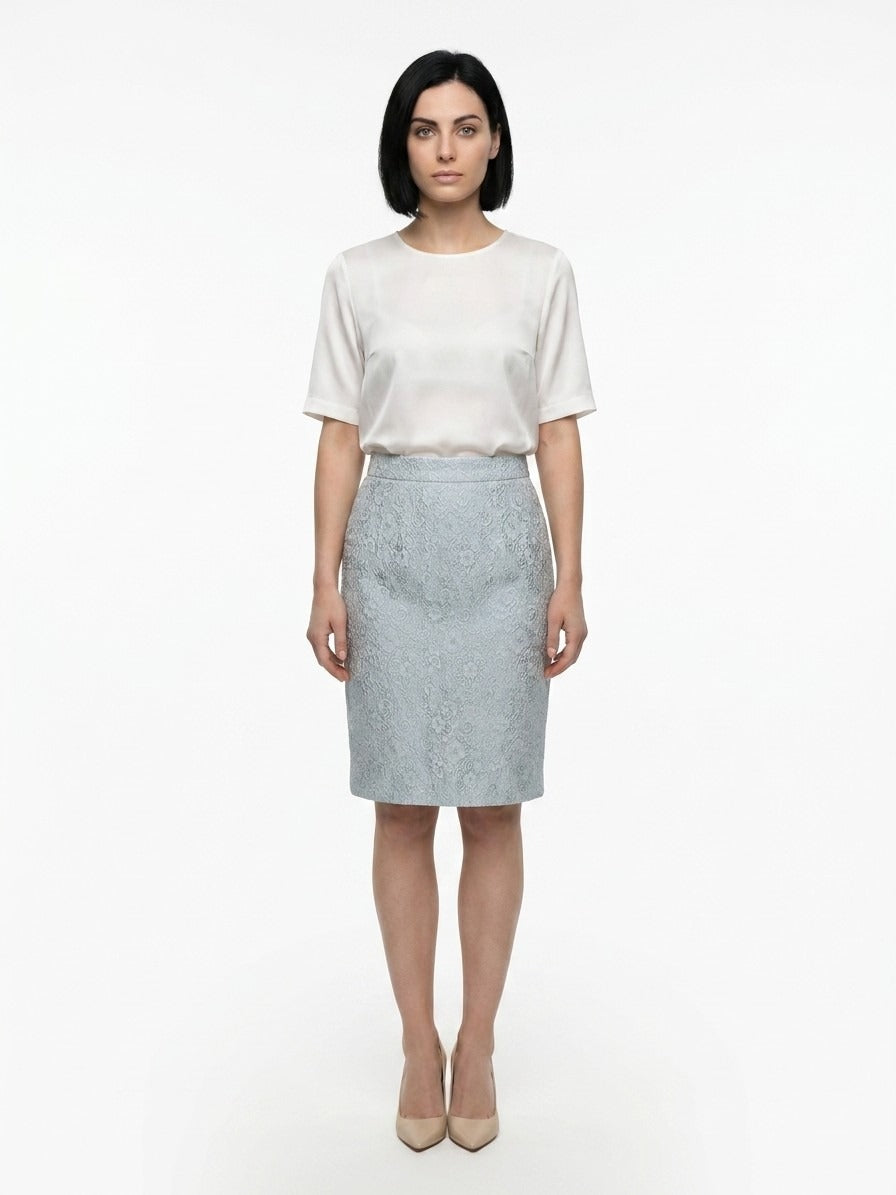 Skirt by Dolce & Gabbana for women in polyester cotton nylon & silk light-blue showcases a dramatic silhouette, artfully capturing the essence of the Women's Polyester Cotton Nylon & Silk Midi Skirt in a dramatic midi cut for a refined look.
