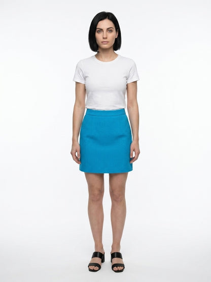 Skirt by Dolce & Gabbana for women in stretch polyester cotton turquoise showcases a dramatic silhouette, artfully capturing the essence of the Women's Stretch Polyester Cotton Mini Skirt in a dramatic mini cut for a refined look.