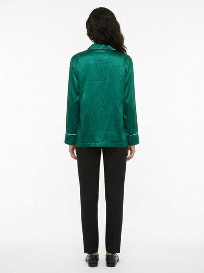 Pajamas by Dolce & Gabbana for women in silk green features a enveloping silhouette, artfully capturing the enveloping essence of the Women's Silk Pajamas design for a sophisticated lounging look.