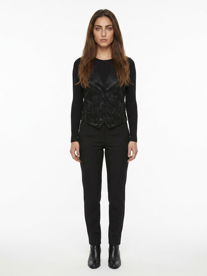 Vest by Dolce & Gabbana for women in polyester cotton viscose & silk black showcases a utilitarian silhouette, artfully incorporating and a utilitarian for a truly utilitarian finish.