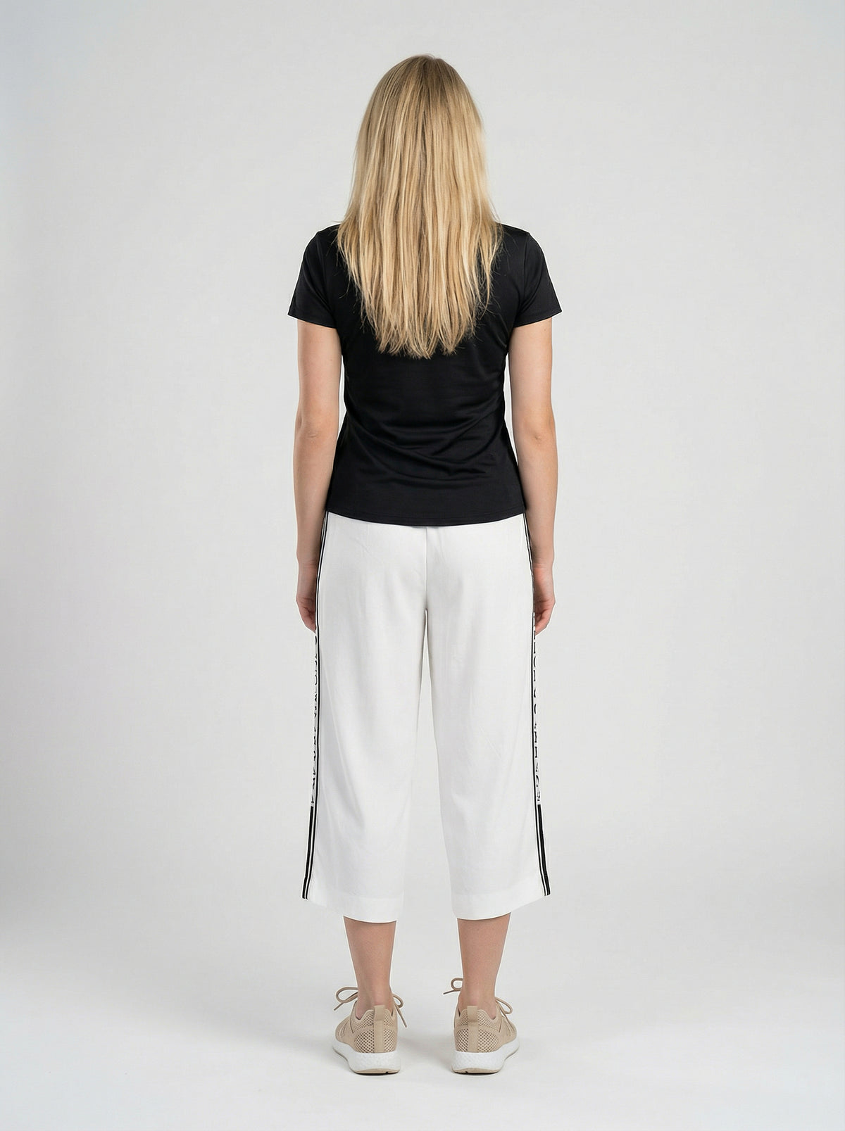 Activewear T-Shirt by Dolce & Gabbana for women in elastane white presents a kinetic silhouette, showcasing the kinetic and alongside functional for a premium, athletic look.
