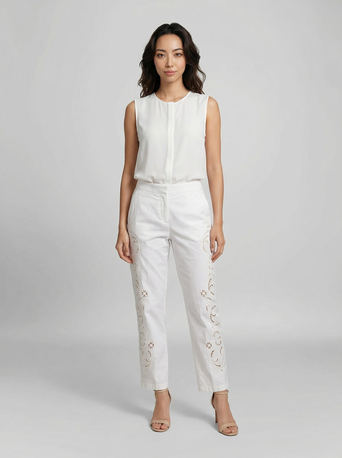 Casual Pants by Dolce & Gabbana for women in cotton viscose white presents a tailored silhouette, showcasing a tailored and long cut with a refined for a truly tailored aesthetic.