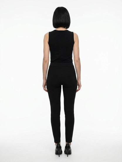 Trousers by Dolce & Gabbana for women in acetate & stretch viscose black presents a smart silhouette, meticulously detailed with a smart skinny, a smart long, and a smart .