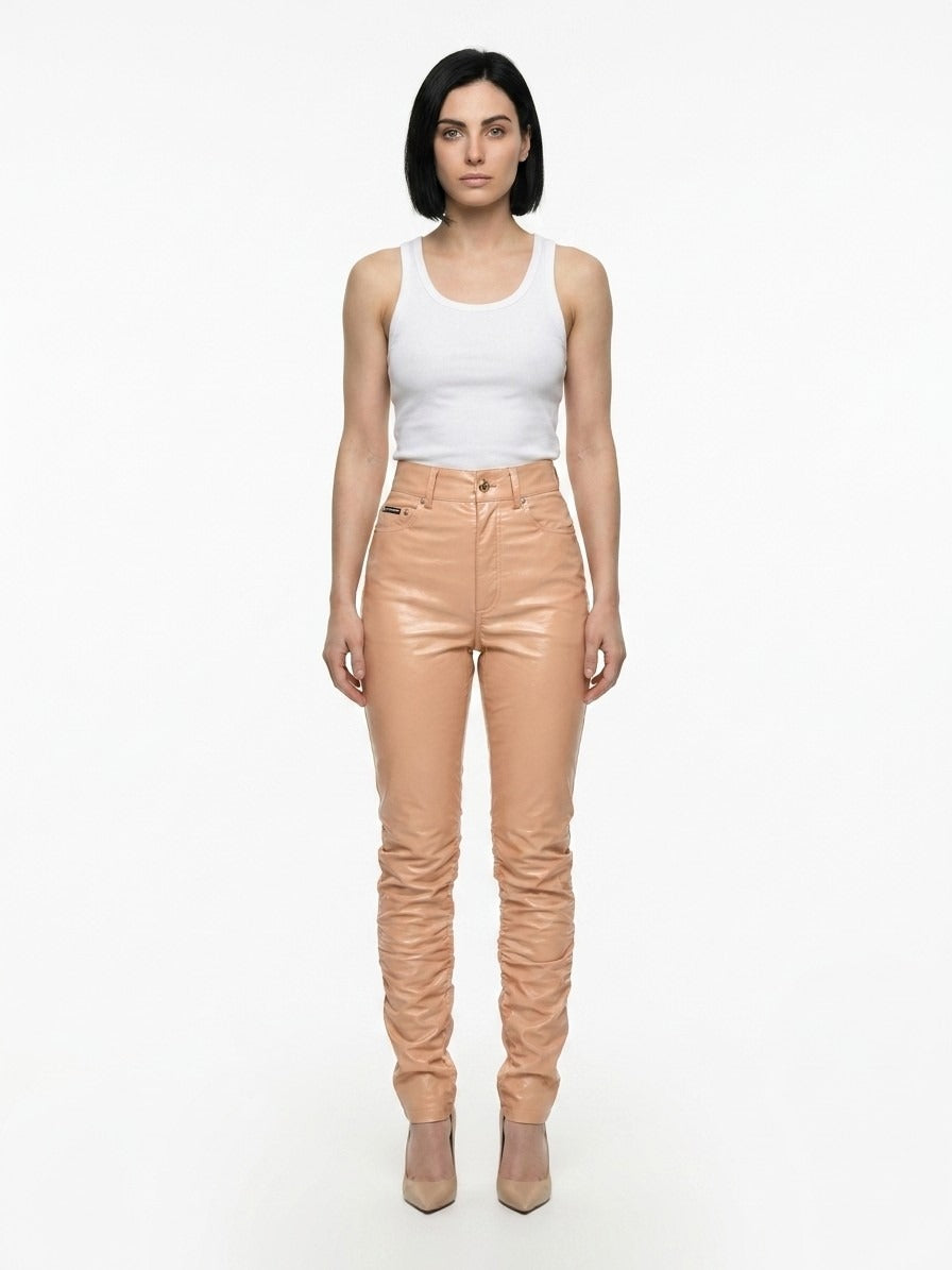 Pants by Dolce & Gabbana for women in polyurethane leather & cotton pink features an on trend silhouette with a and cut in an elegant long for a sophisticated look.