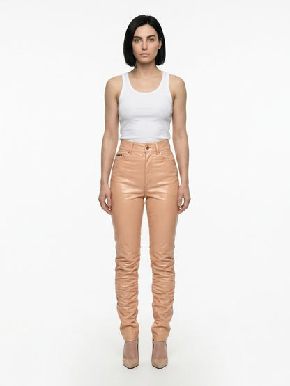 Pants by Dolce & Gabbana for women in polyurethane leather & cotton pink features an on trend silhouette with a and cut in an elegant long for a sophisticated look.