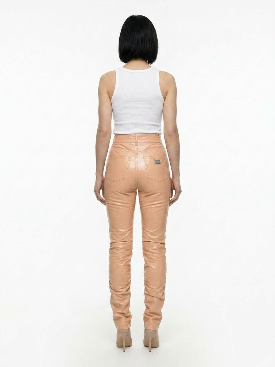 Pants by Dolce & Gabbana for women in polyurethane leather & cotton pink features an understated silhouette, showcasing a sophisticated and long with a refined for an understated, polished aesthetic.