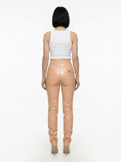 Pants by Dolce & Gabbana for women in polyurethane leather & cotton pink features an understated silhouette, showcasing a sophisticated and long with a refined for an understated, polished aesthetic.