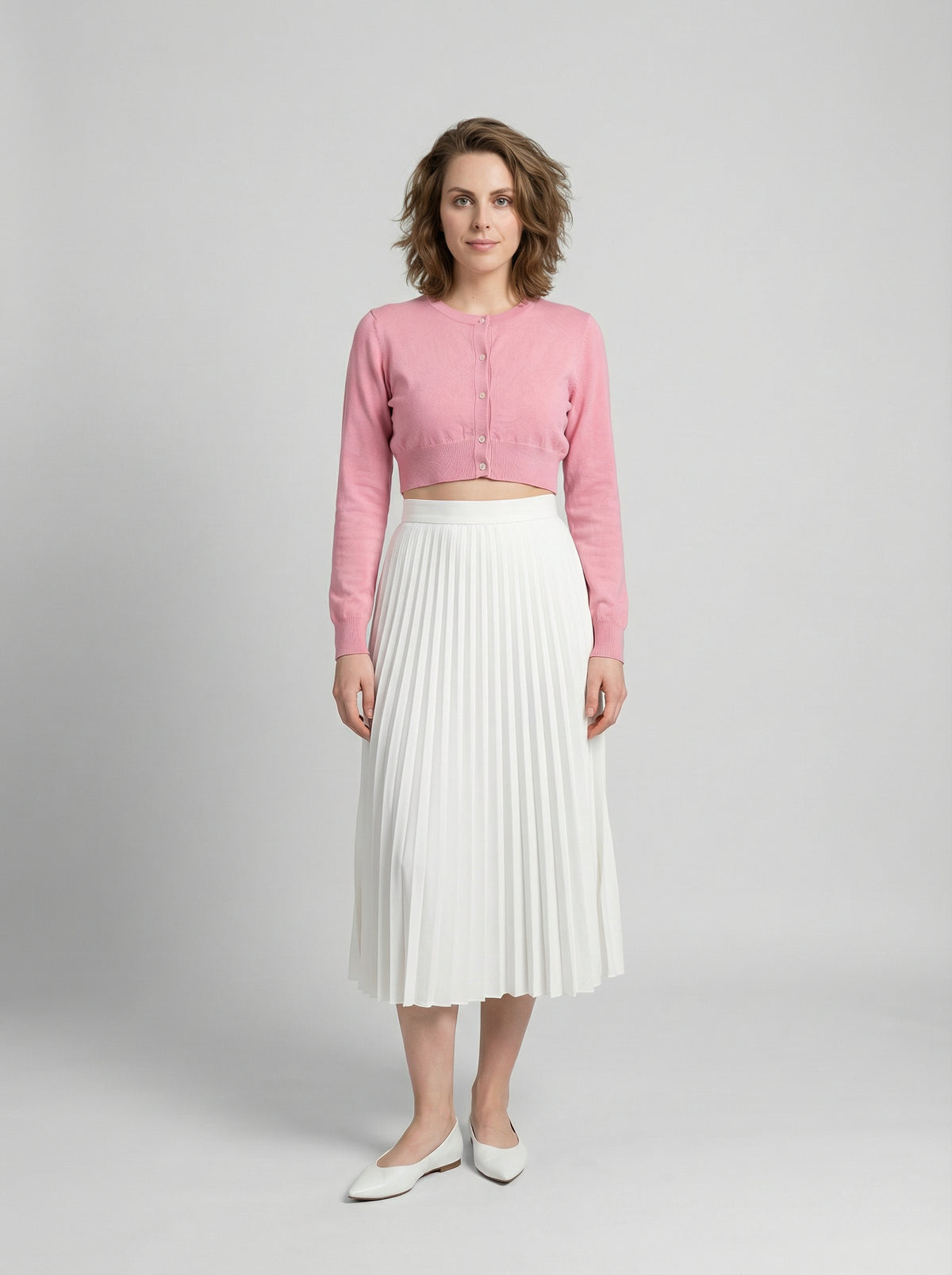 Cardigan by Dolce & Gabbana for women in silk pink showcases a luxurious silhouette, meticulously detailed with a sophisticated and for a refined finish.