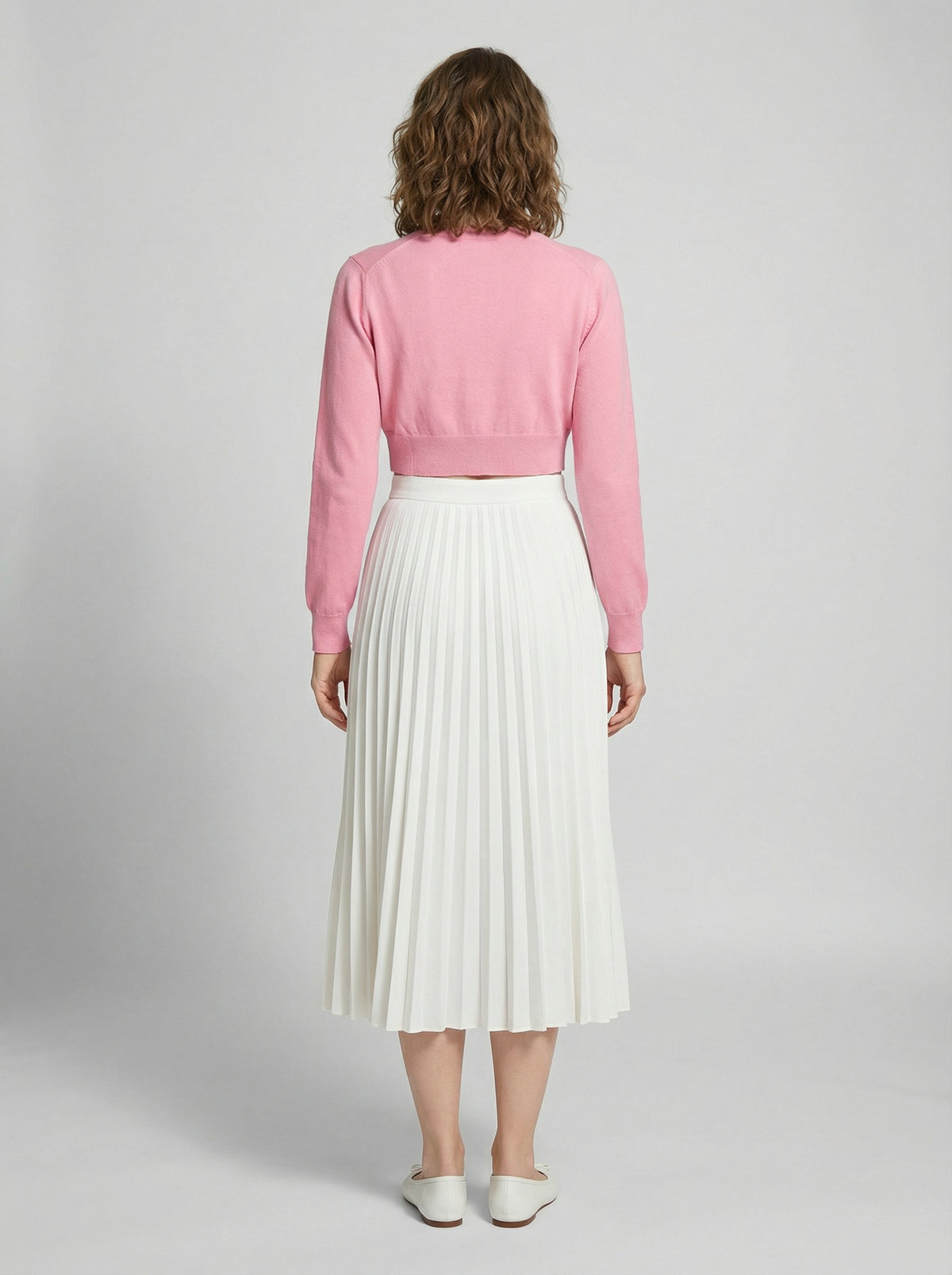 Cardigan by Dolce & Gabbana for women in silk pink features a dramatic silhouette, showcasing a sophisticated and dramatic detail for a timeless, premium look.