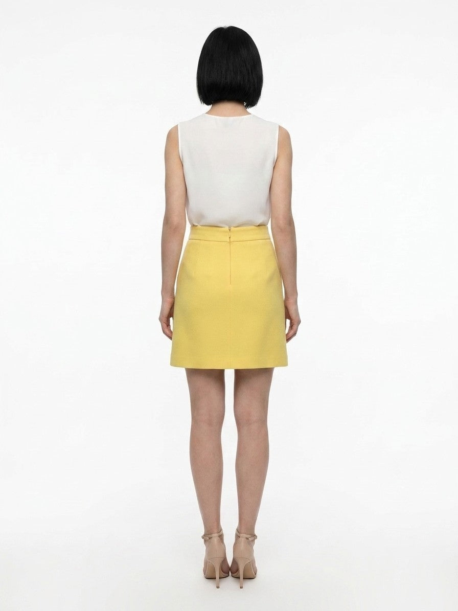 Skirt by Dolce & Gabbana for women in silk wool & elastane yellow features an relaxed-yet-refined silhouette that elegantly showcases the Women's Silk Wool & Elastane Mini Skirt design and sophisticated mini.