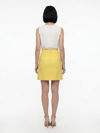 Skirt by Dolce & Gabbana for women in silk wool & elastane yellow features an relaxed-yet-refined silhouette that elegantly showcases the Women's Silk Wool & Elastane Mini Skirt design and sophisticated mini.