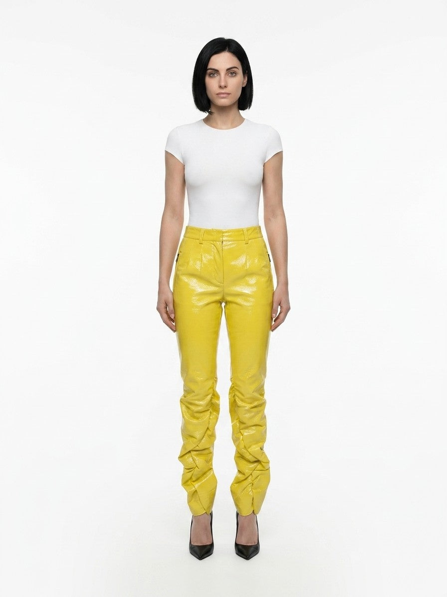 Trousers by Dolce & Gabbana for women in polyester yellow presents a smart silhouette, meticulously detailed with a smart , a smart long, and a smart .