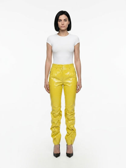Trousers by Dolce & Gabbana for women in polyester yellow presents a smart silhouette, meticulously detailed with a smart , a smart long, and a smart .