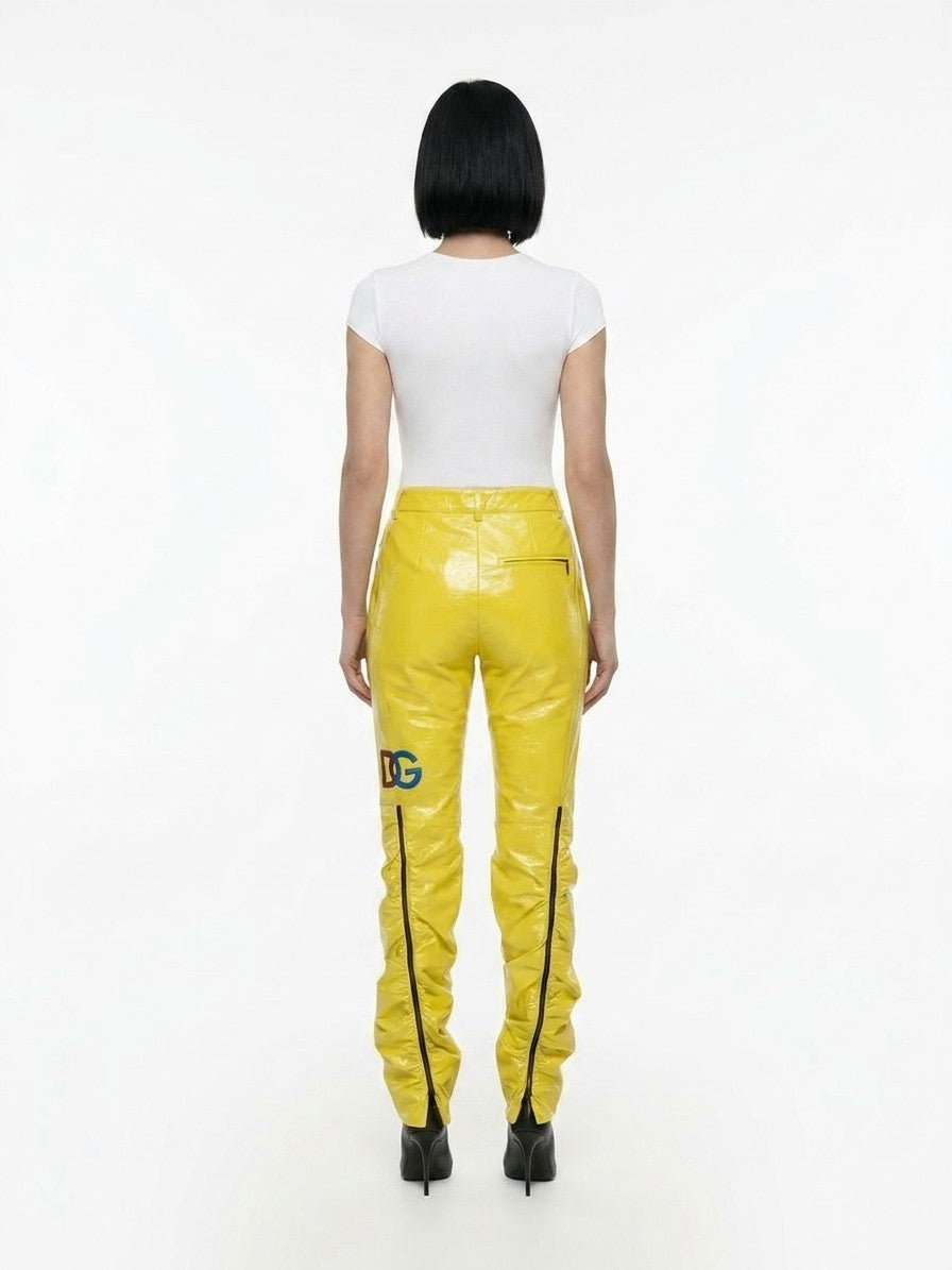 Trousers by Dolce & Gabbana for women in polyester yellow features an sartorial silhouette, showcasing a precise and long with a sartorial for a refined look.